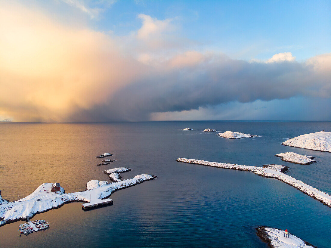 Europe, Norway, Soroya island, Sorvaer, Aerial view of the town at sunrise