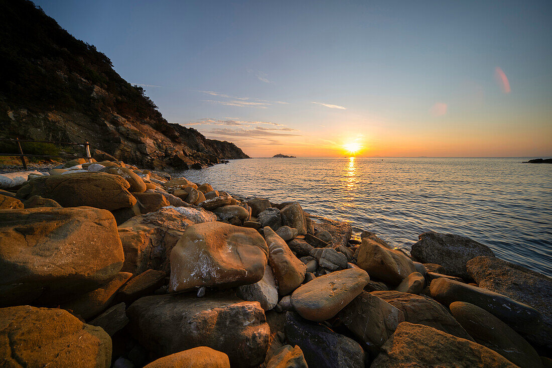 Italy, Tuscany, Punta Ala, Sparrow rock at sunset
