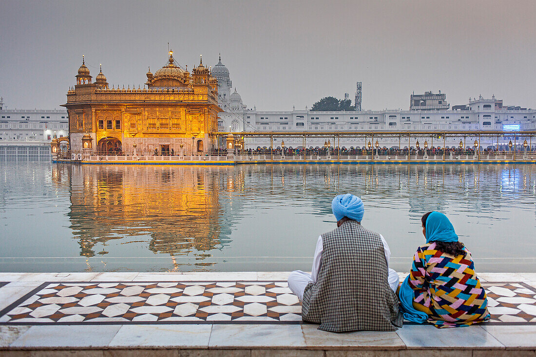 pilgrims and sacred pool Amrit Sarovar, Golden temple, Amritsar, Punjab, India
