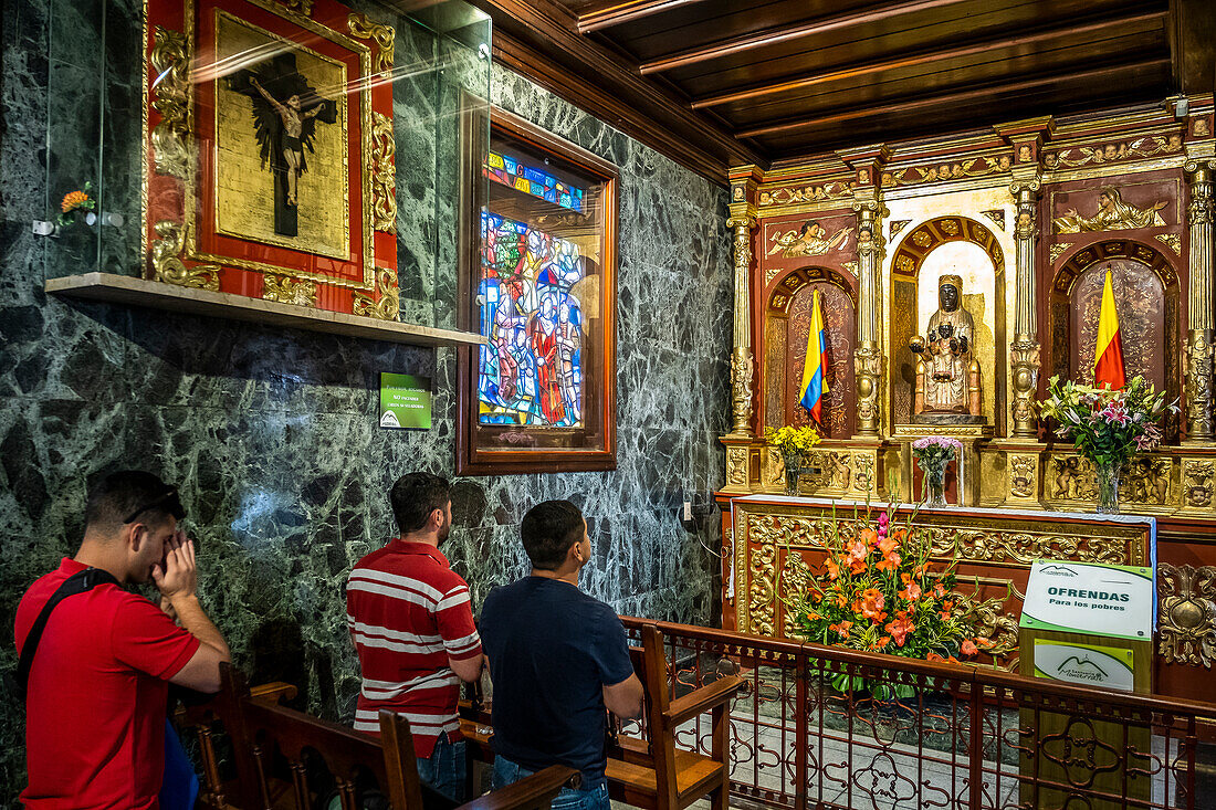 Santuario del Senor de Monserrate, people praying to Morena virgin from Montserrat or Moreneta, Church, Bogota, Colombia