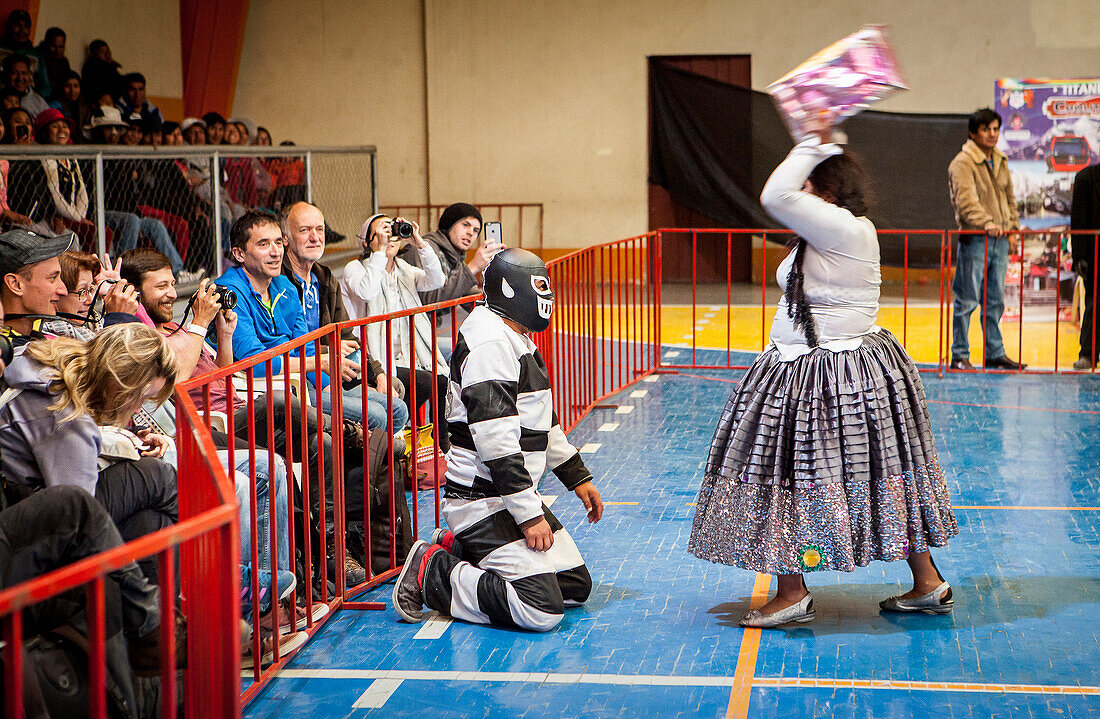 Lucha Libre. Combat between El Prisionero and the cholita Angela la folclorista, wrestlers ,Sports center La Ceja, El Alto, La Paz, Bolivia