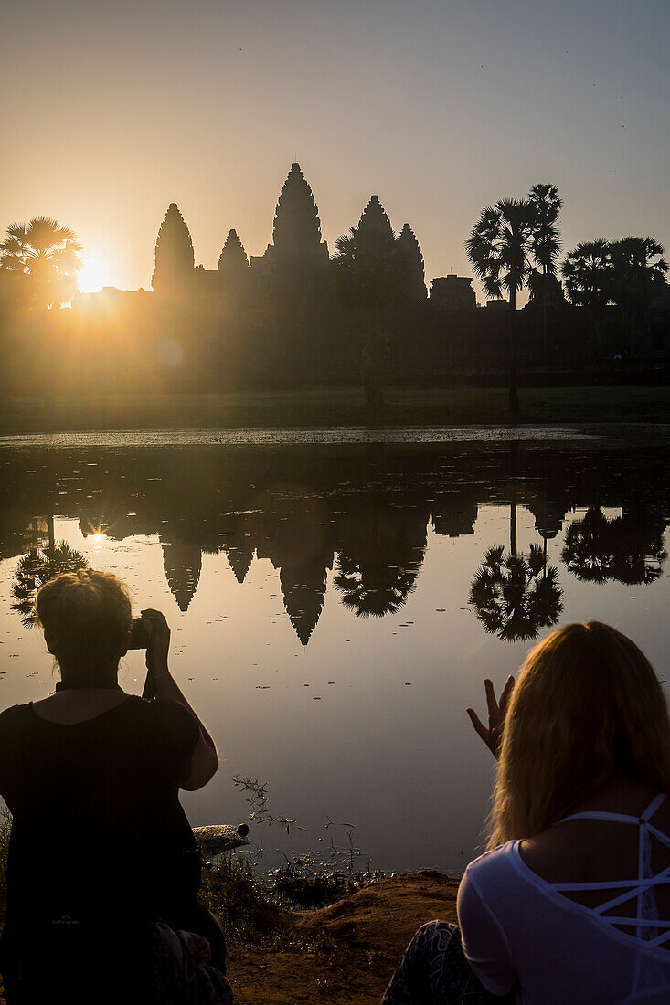 Tourists watching sunrise at Angkor Wat, Siem Reap, Cambodia