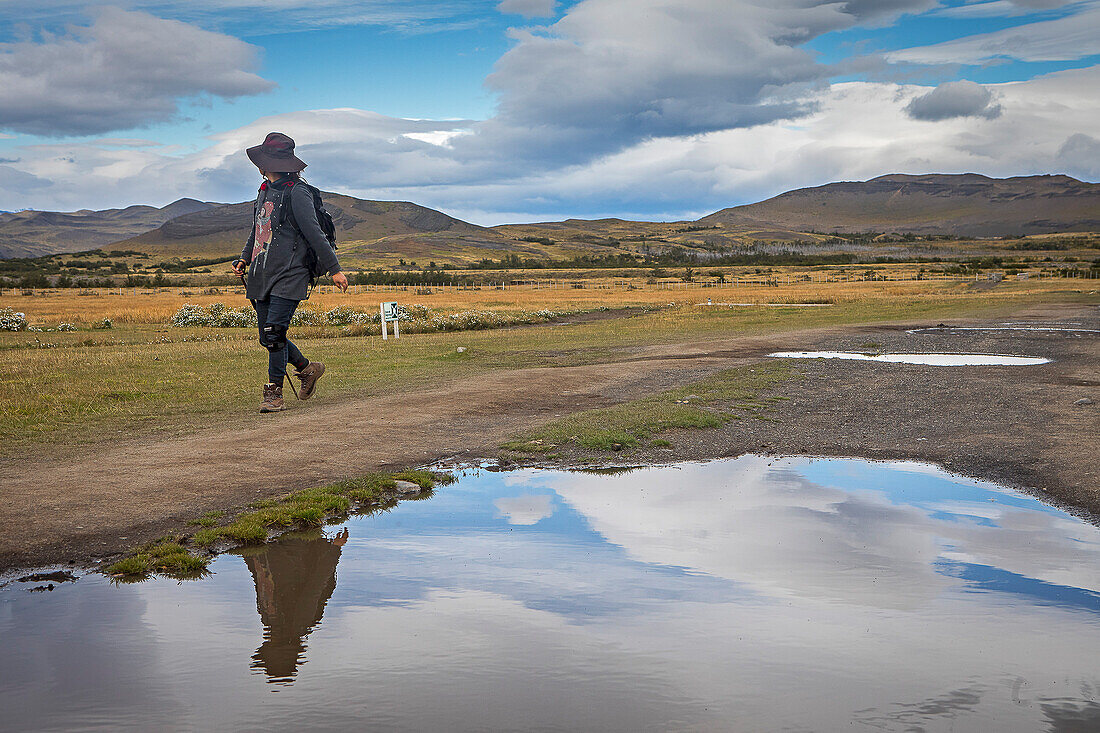 Hiker walking in Torres Sector, Torres del Paine national park, Patagonia, Chile