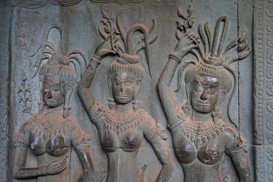 Aspara sculptures in bas-relief on the wall, in Angkor Wat, Siem Reap, Cambodia