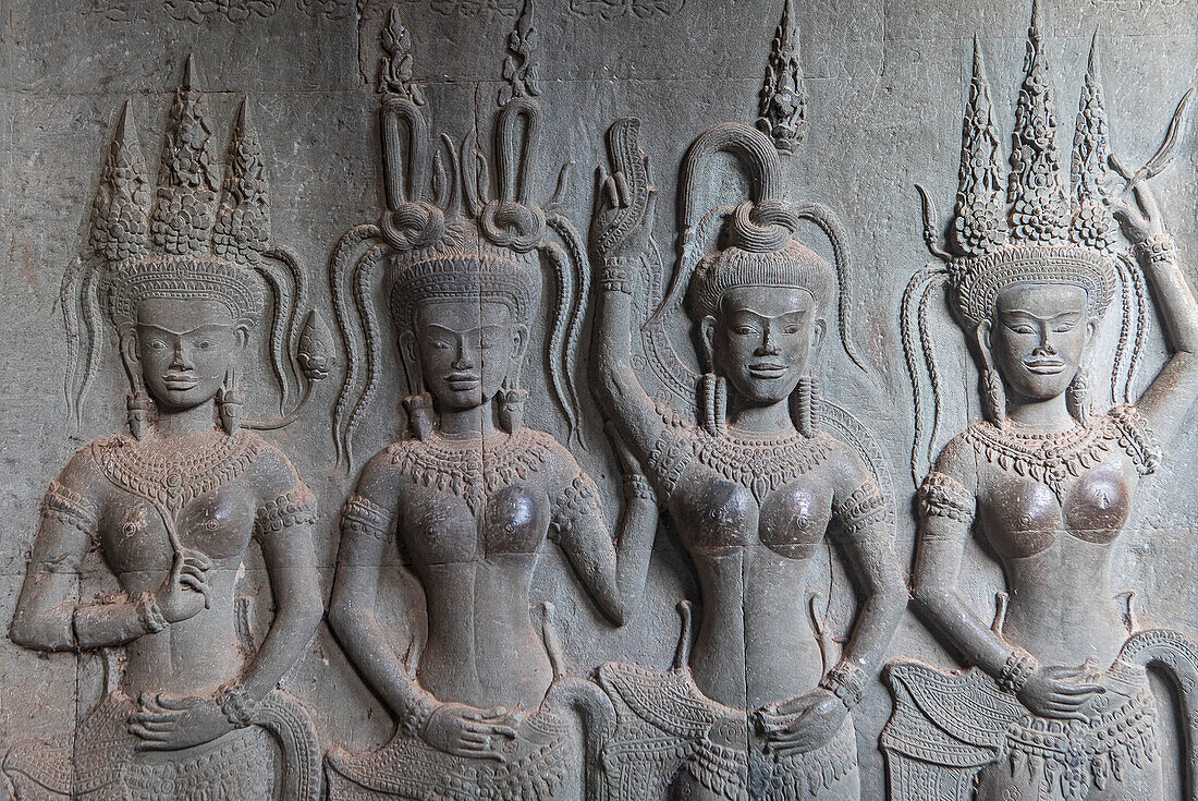 Aspara sculptures in bas-relief on the wall, in Angkor Wat, Siem Reap, Cambodia