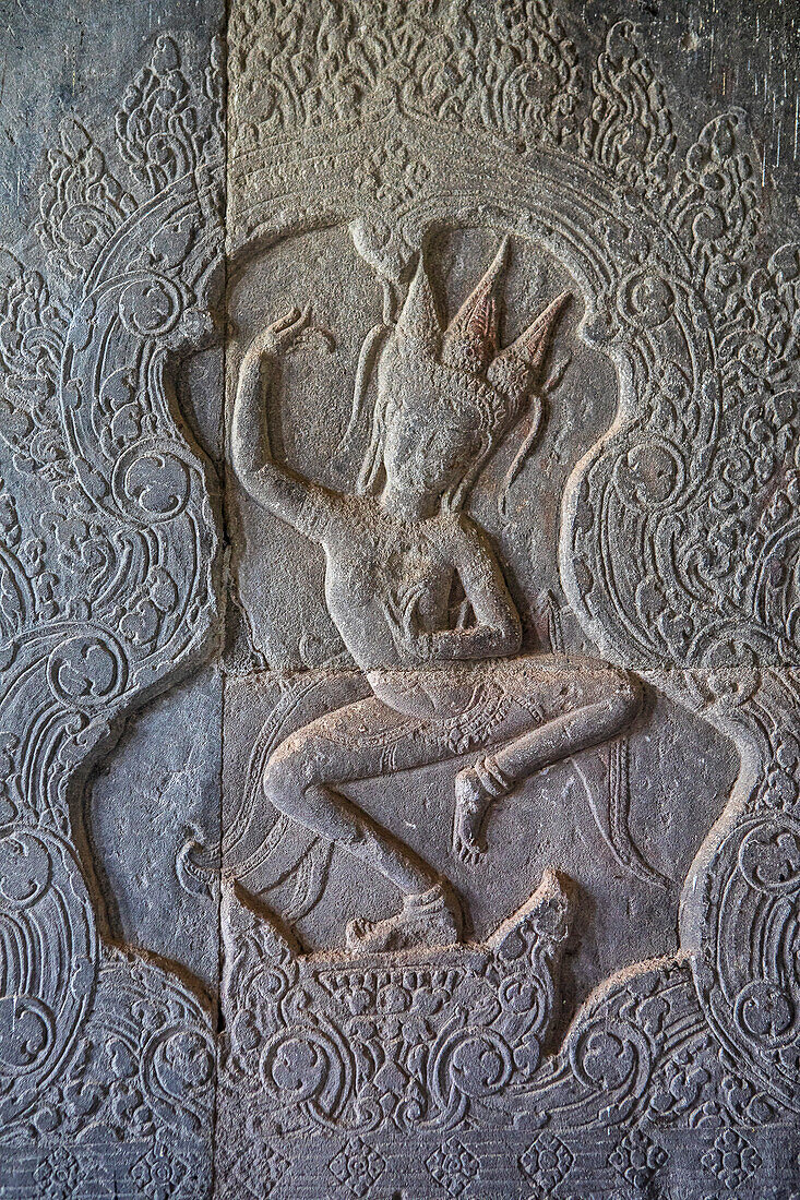 Aspara sculpture in bas-relief on the wall, in Angkor Wat, Siem Reap, Cambodia