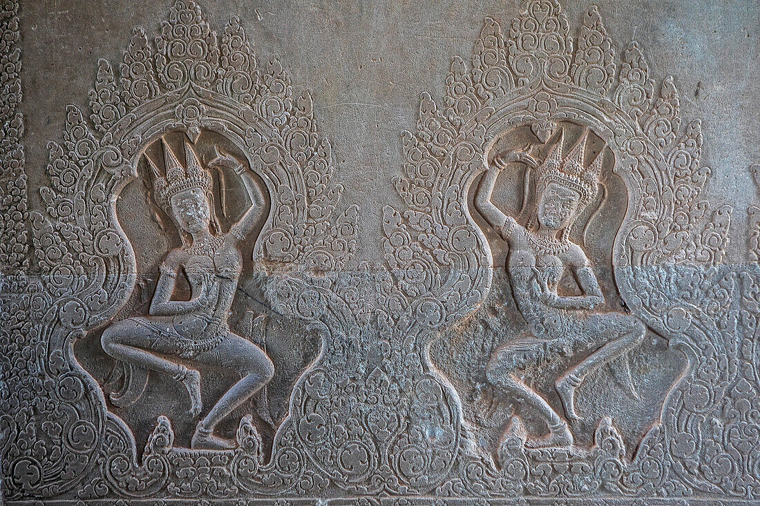 Aspara sculptures in bas-relief on the wall, in Angkor Wat, Siem Reap, Cambodia