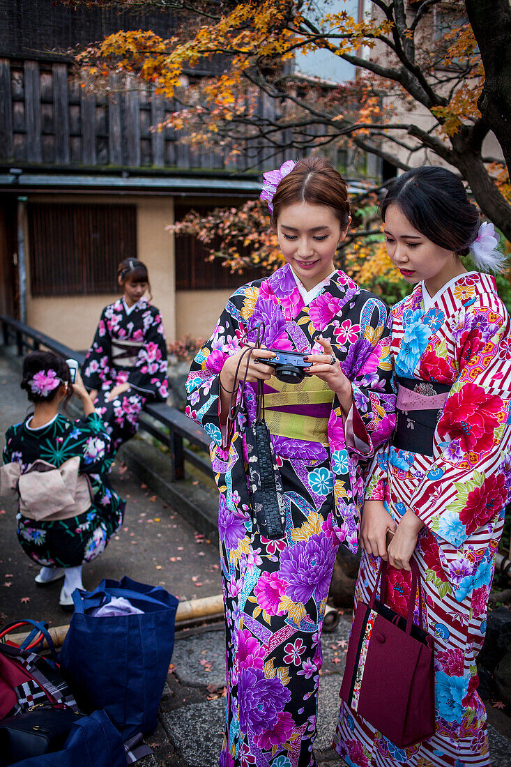 women dressed in kimono, in Shirakawa-minami-dori, Gion district, Kyoto. Kansai, Japan.