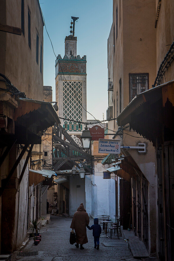 Talaa Kebira street, and minaret of Chrabliyine Mosque. Fez. Morocco