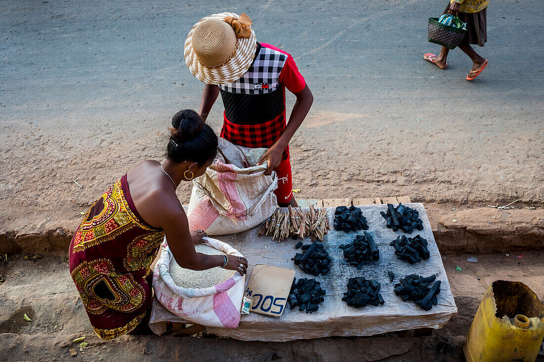 Saleswoman of rice, firewood and coal, in Antananarivo, Madagascar