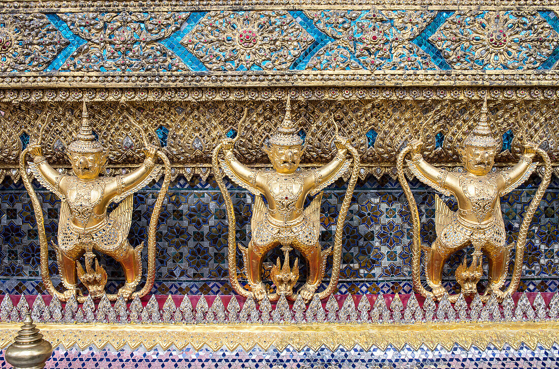 Gold Kinnara statues, Temple of the emerald Buddha, Wat Phra Kaeo temple, Grand Palace, Bangkok, Thailand
