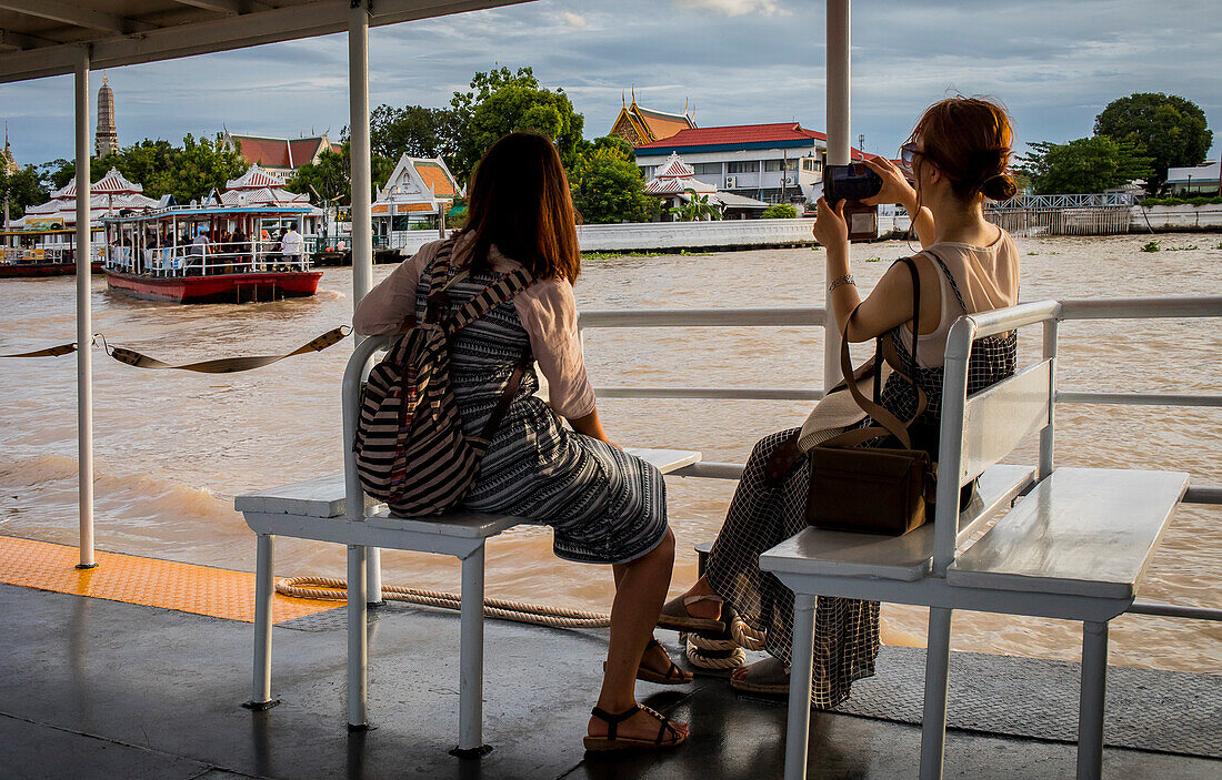 Passengers on express ferry boat, Chao phraya river, Bangkok, Thailand