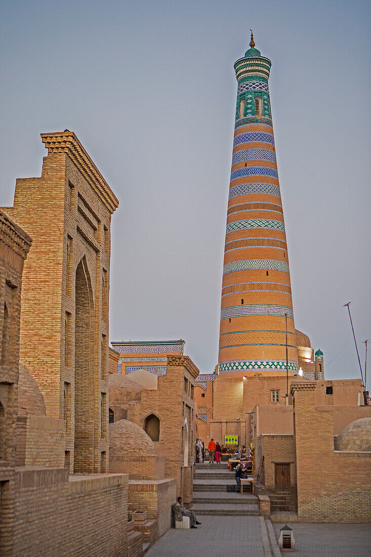 Islom Hoja Minaret. At left Pahlavon Mahmud Mausoleum, Khiva, Uzbekistan