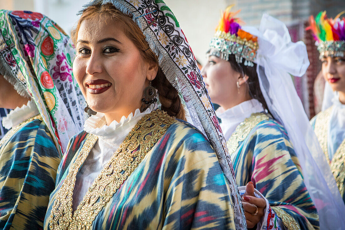 women in traditional dress, for folk dance, dancer, in Rukhobod Mausoleum, Samarkand, Uzbekistan