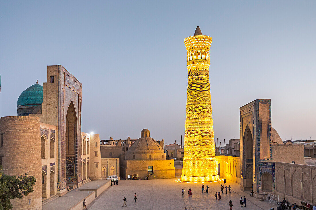 At right Kalon minaret and mosque. At left Mir-i-Arab medressa , Bukhara, Uzbekistan