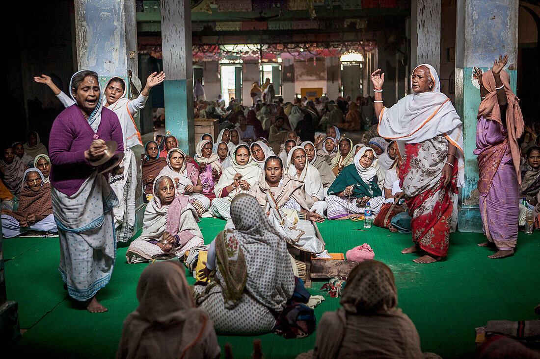 Widows praying in a Bhajan ashram, Vrindavan, Mathura district, India