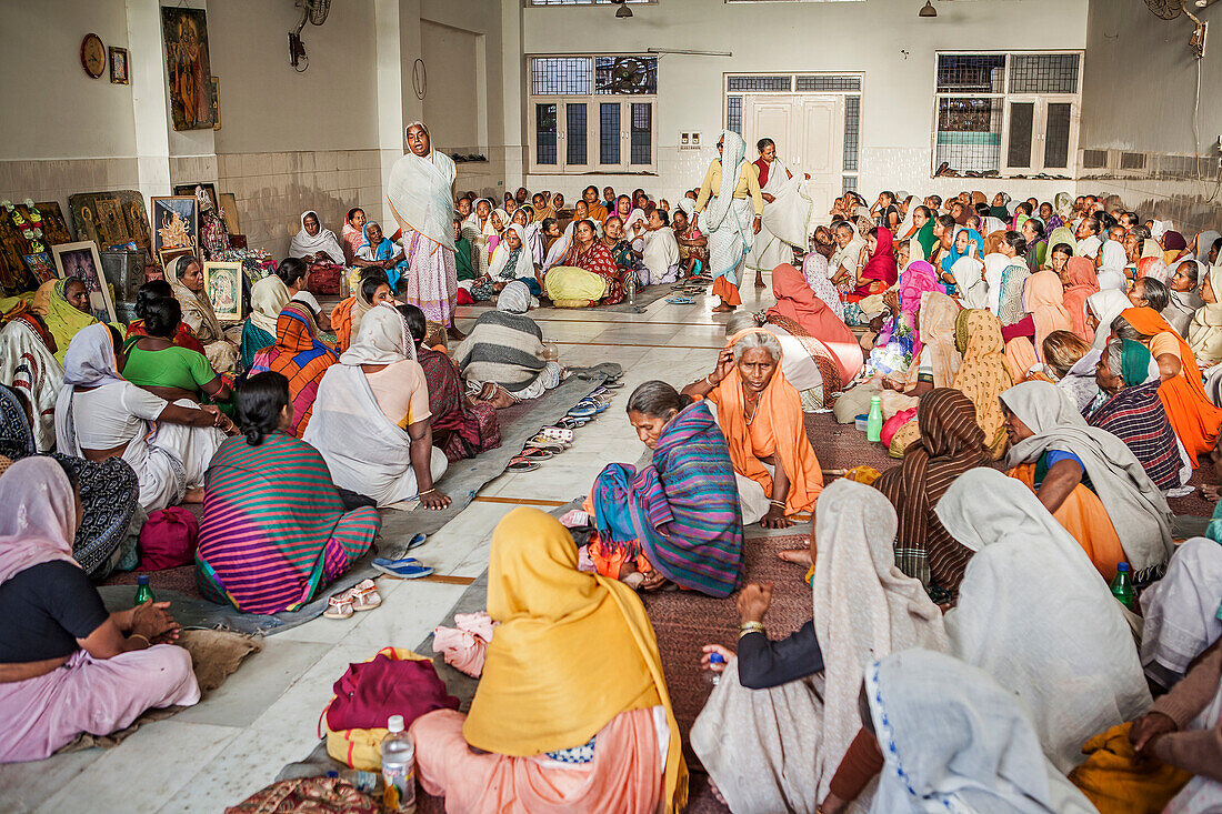 Widows praying in an Balaji ashram, Vrindavan, Mathura district, India