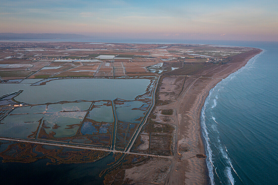 Aerial view of marshes, the Tancada lagoon, rice fields, Eucaliptos beach and l´Alfaca beach; Sant Carles de la Rapita, Ebro Delta, Natural Park, Tarragona, Spain