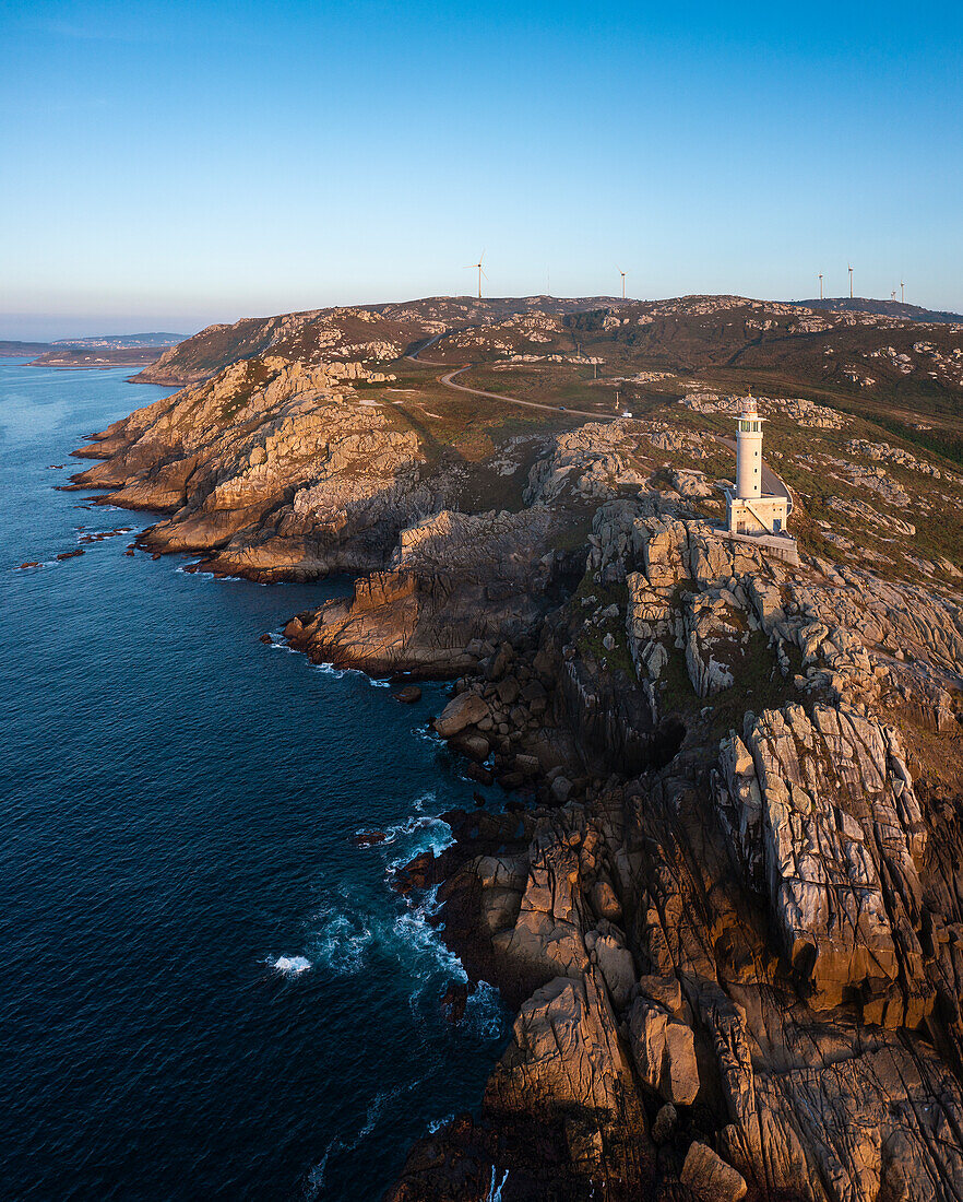 Aerial view of Punta Nariga lighthouse at sunset, Costa da Morte, Galicia, Spain, Iberian Peninsula, Western Europe