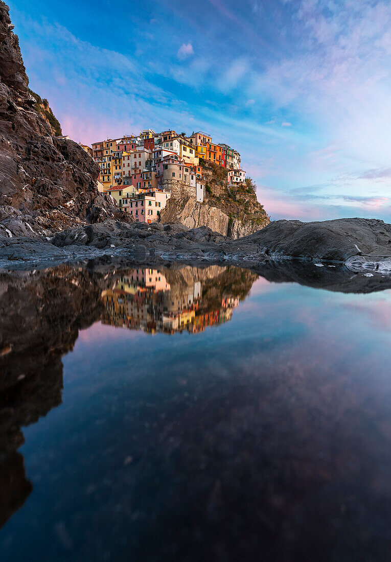 Reflection of Manarola at sunset, La Spezia, Liguria, Italy, Southern Europe