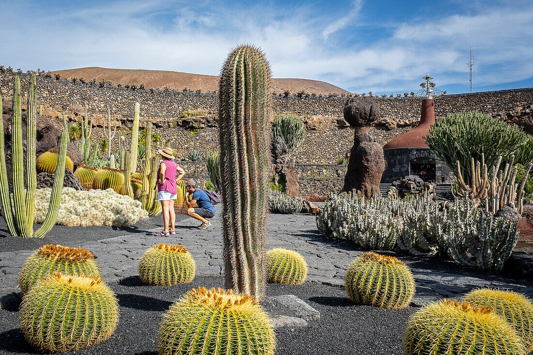 Tourists visiting the Cactus garden, creation of artist Cesar Manrique, Lanzarote, Canary Islands, Europe