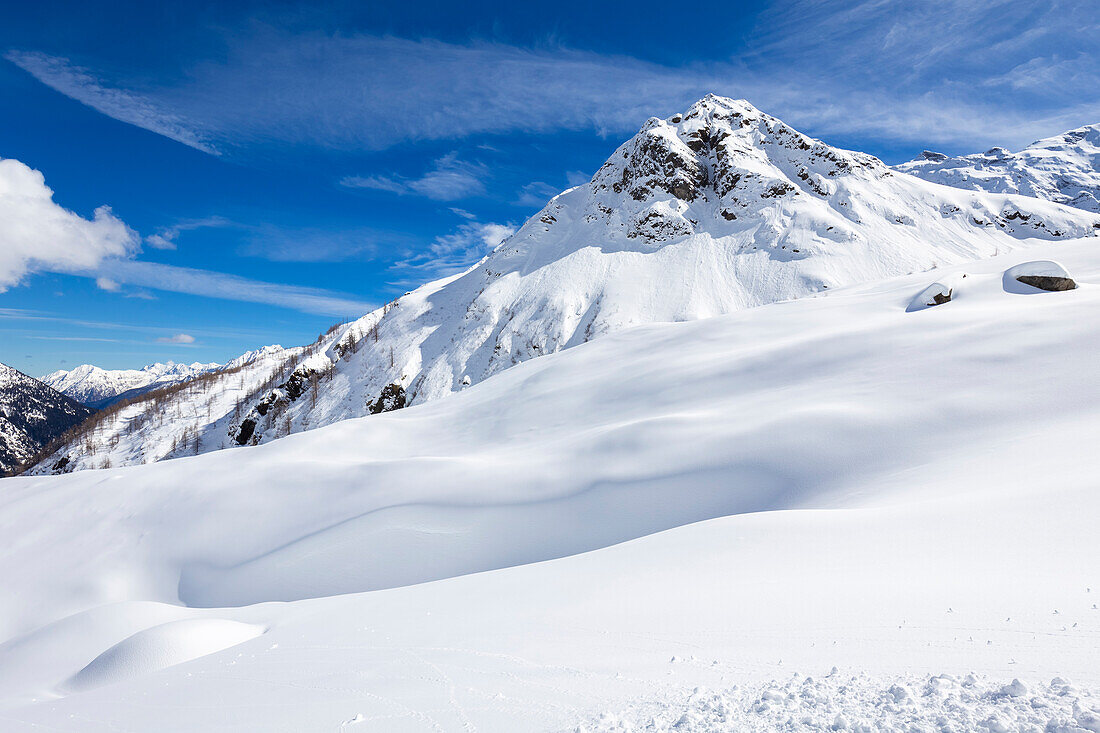 View of Pizzo Bianco and Punta Battisti from the winter track on Belvedere Glacier at the foot of the East face of Monte Rosa Massif. Macugnaga, Anzasca Valley, Verbano Cusio Ossola province, Piedmont, Italy.