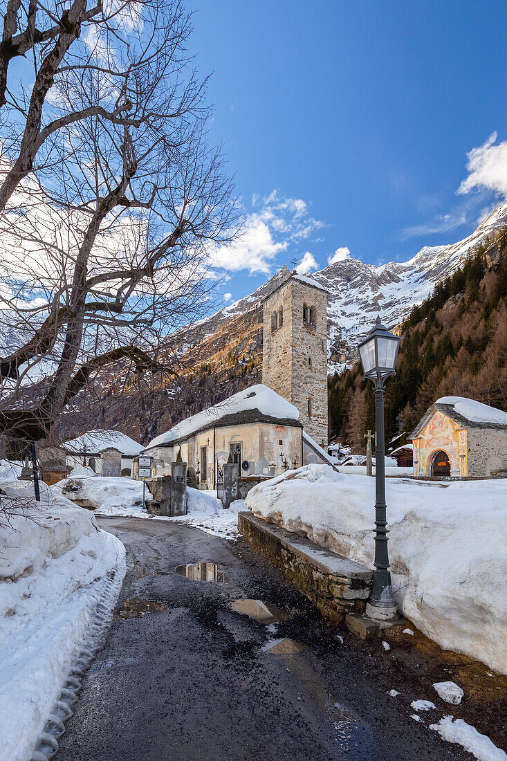 View of the old church of Staffa, Santa Maria Assunta, in winter. Macugnaga, Anzasca Valley, Verbano Cusio Ossola province, Piedmont, Italy.