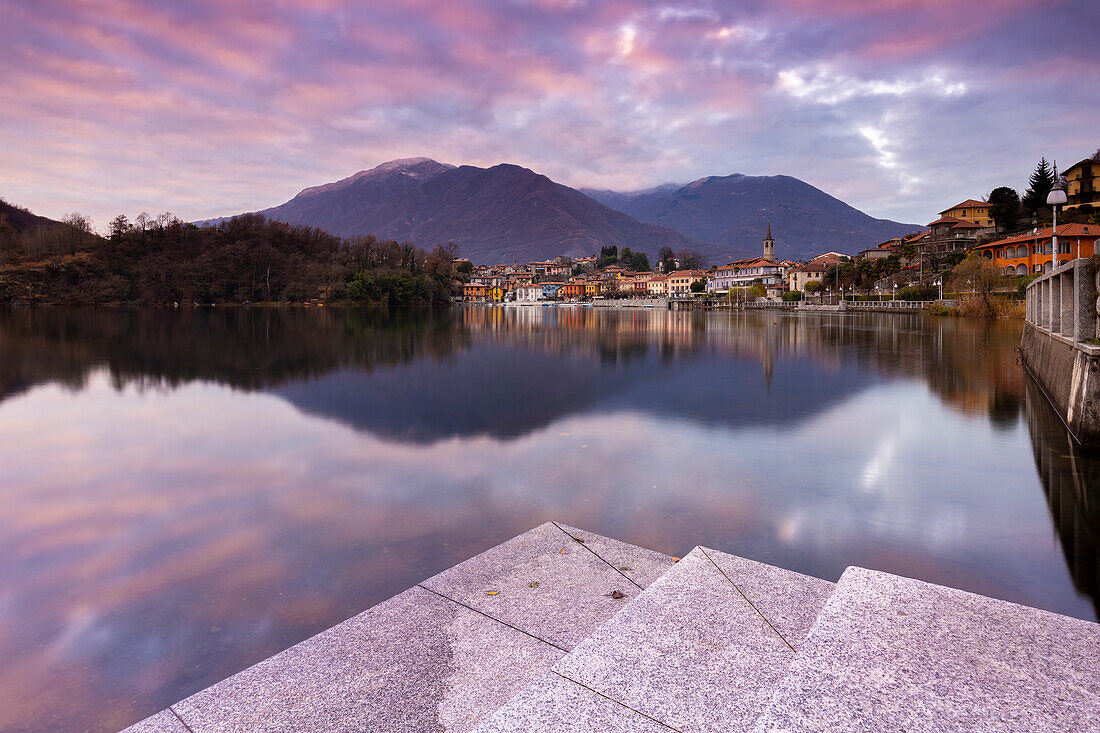 View of the small town of Mergozzo and Lake Mergozzo during a winter sunset. Verbano Cusio Ossola, Piedmont, Italy.