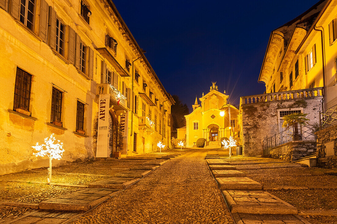 The golden lights of the small town of Orta during blue hour. Orta San Giulio, Orta Lake, Province of Novara, Piedmont, Italy.