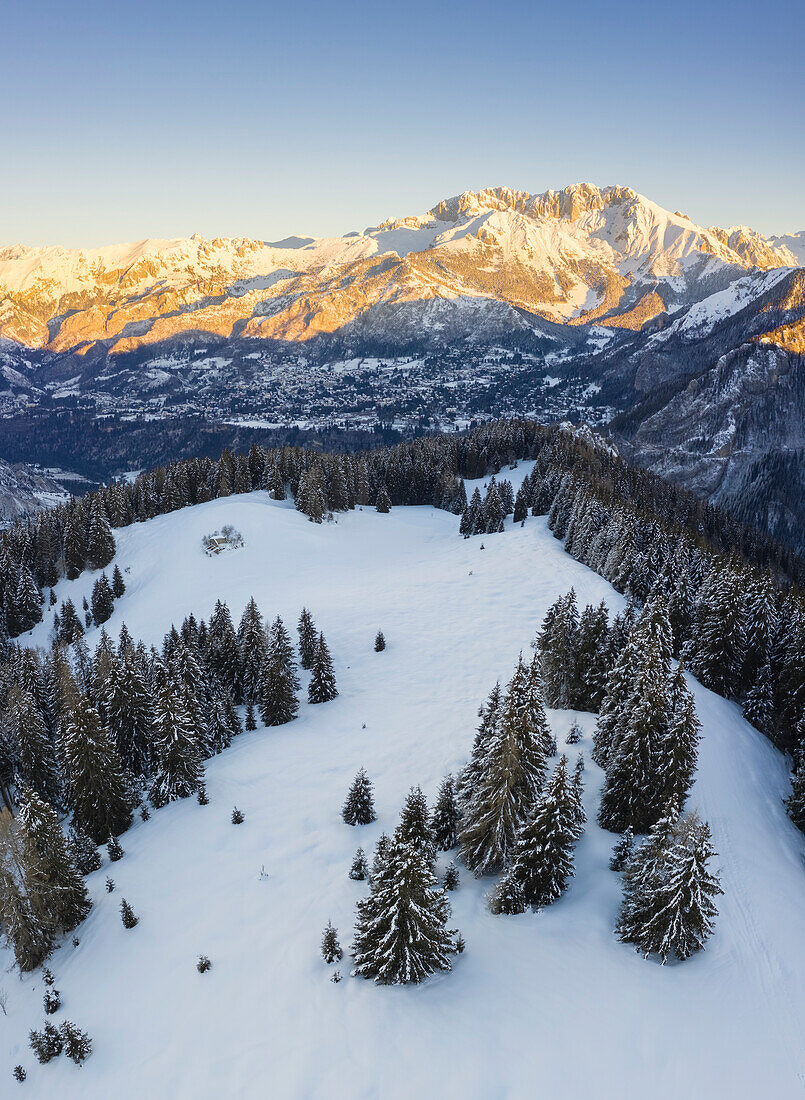 Aerial view of the Presolana massif during a winter sunrise from Monte Pora, Val Seriana, Bergamo district, Lombardy, Italy.