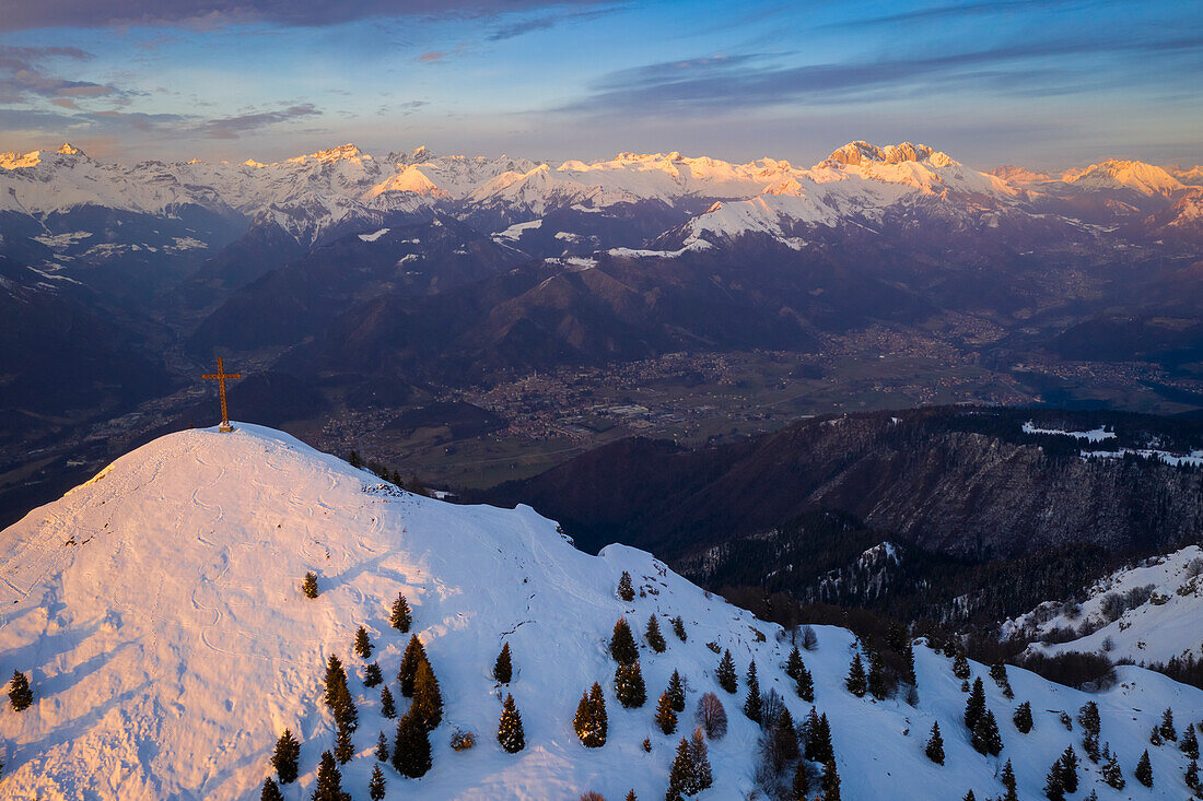 Sunset over a snowy Monte Farno and Pizzo Formico in winter. Monte Farno, Gandino, Valgandino, Val Seriana, Bergamo province, Lombardy, Italy.