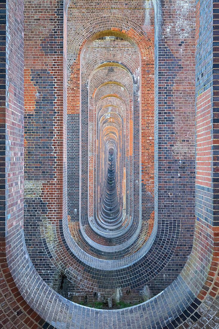 View of the Ouse valley viaduct from the arched vaulting beneath. Sussex, Southern England, United Kingdom.