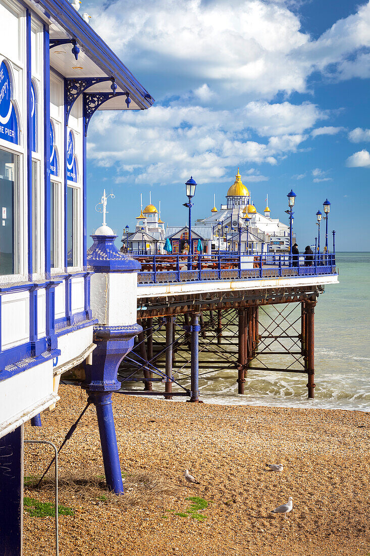 Daylight view of the Eastbourne pier from the shore. Eastbourne, East Sussex, England, United Kingdom.