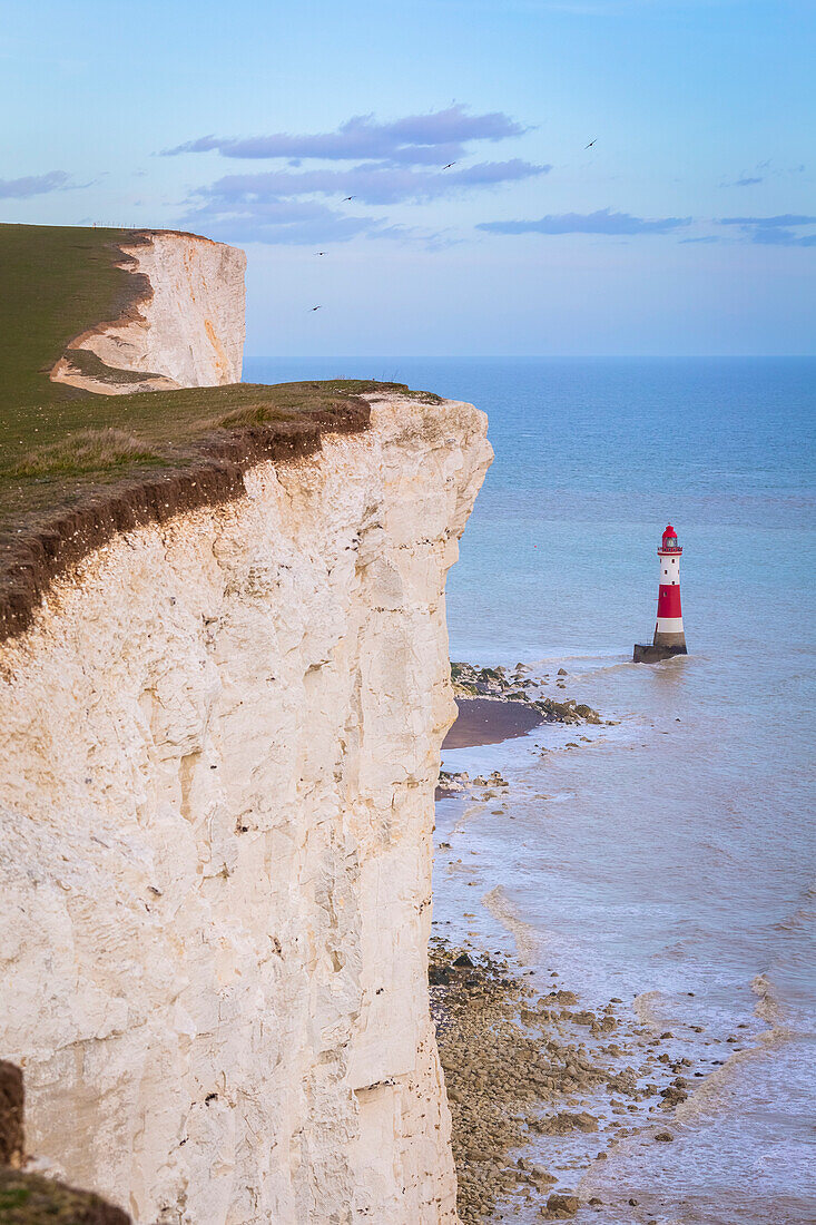 View of Beachy Head, a chalk headland in East Sussex, immediately east of the Seven Sisters and it's lighthouse. Eastbourne, East Sussex, Southern England.