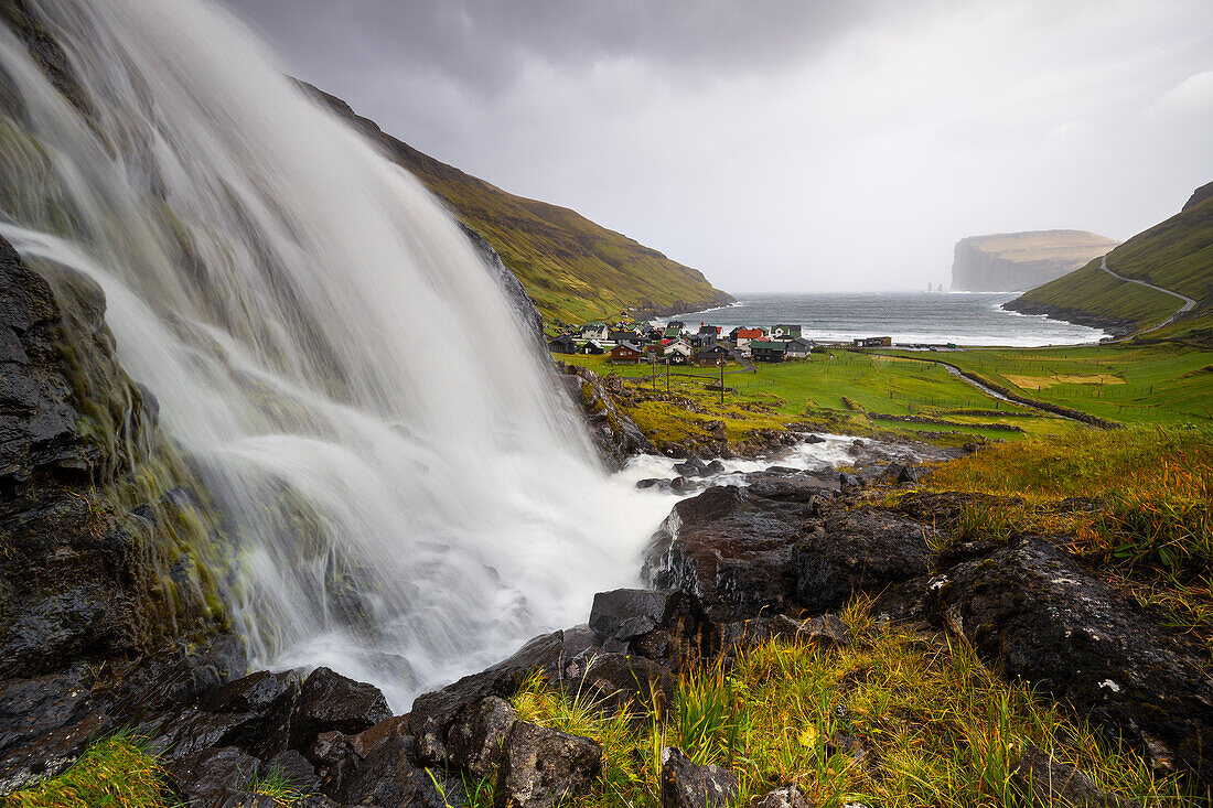 Waterfall and Tjørnuvik village, Sunda municipality, Streymoy, Faroe Islands, Denmark, Scandinavia