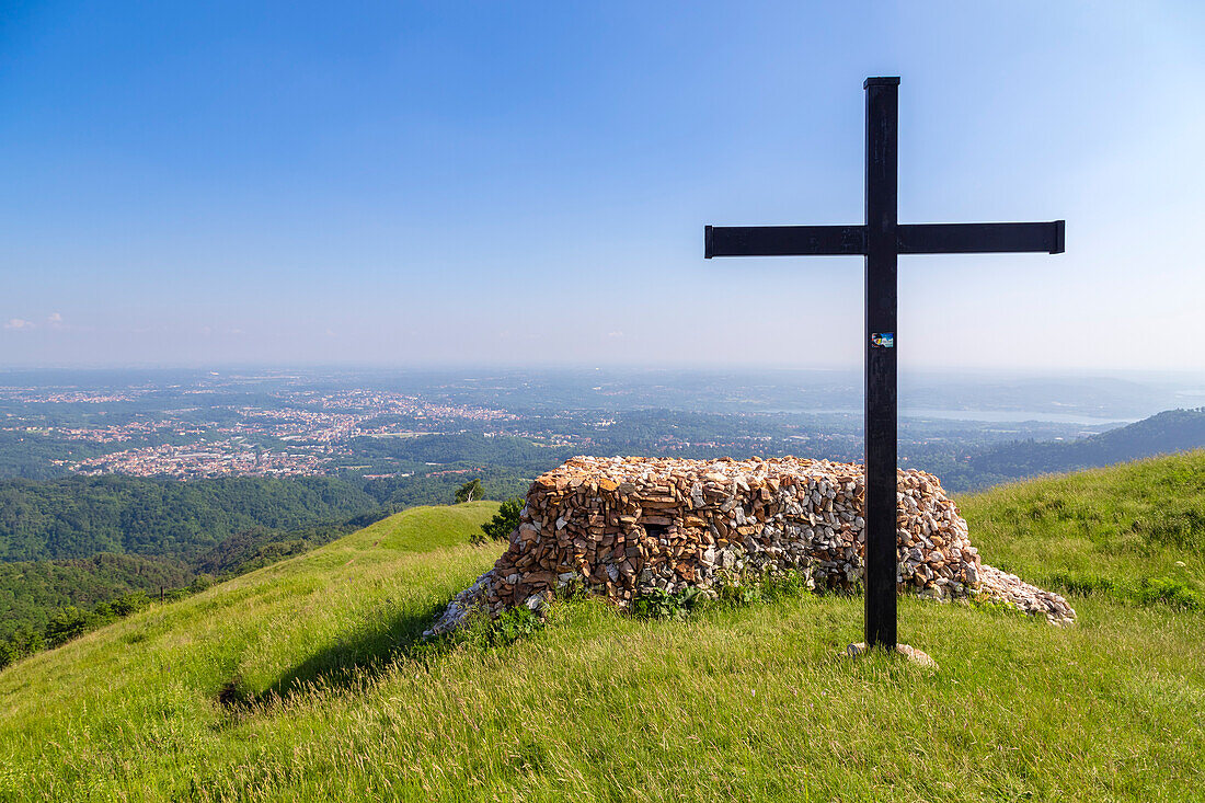 View of the top of Monte Chiusarella with the cross and rocks altair, varesine prealps, Parco Regionale del Campo dei Fiori, Varese district, Lombardy, Italy.
