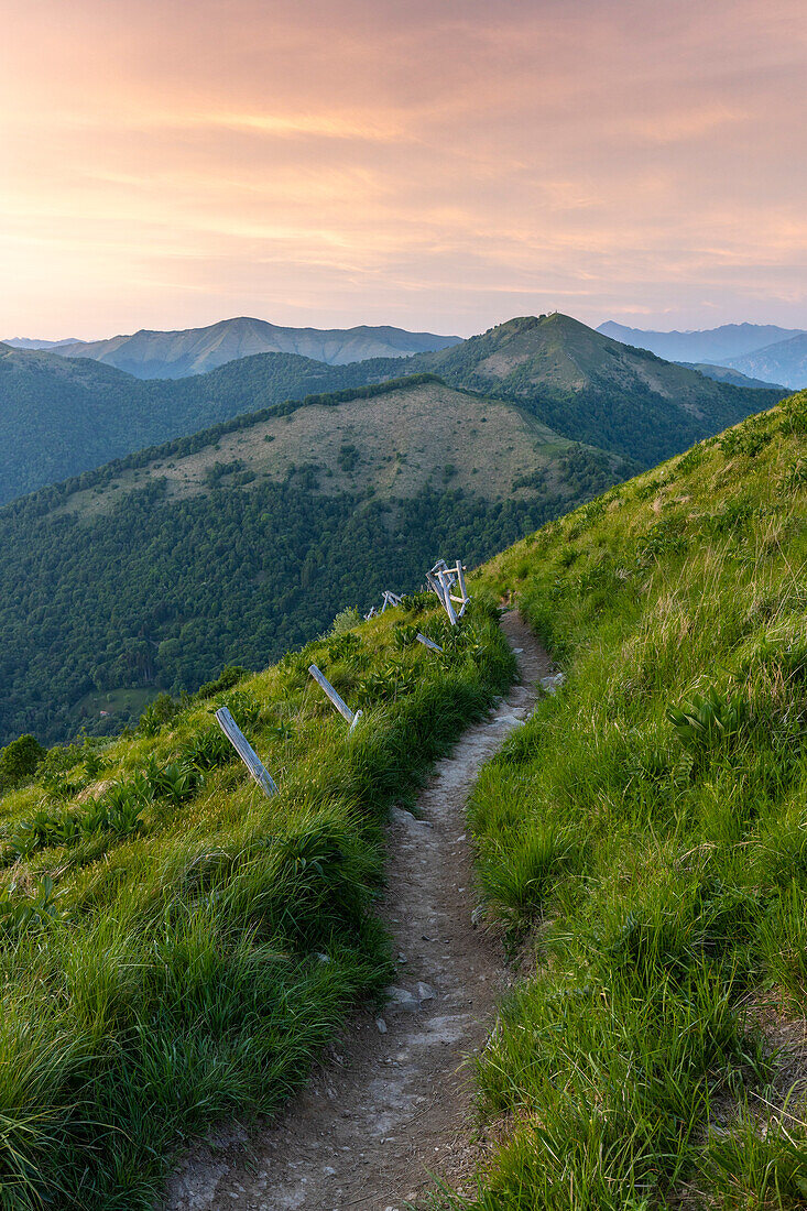 A spring sunset on the Bolettone mount towards Pizzo dell'Asino and Mount Palanzone. Albavilla, Lake Como, Como district, Lombardy, Italy, Europe.