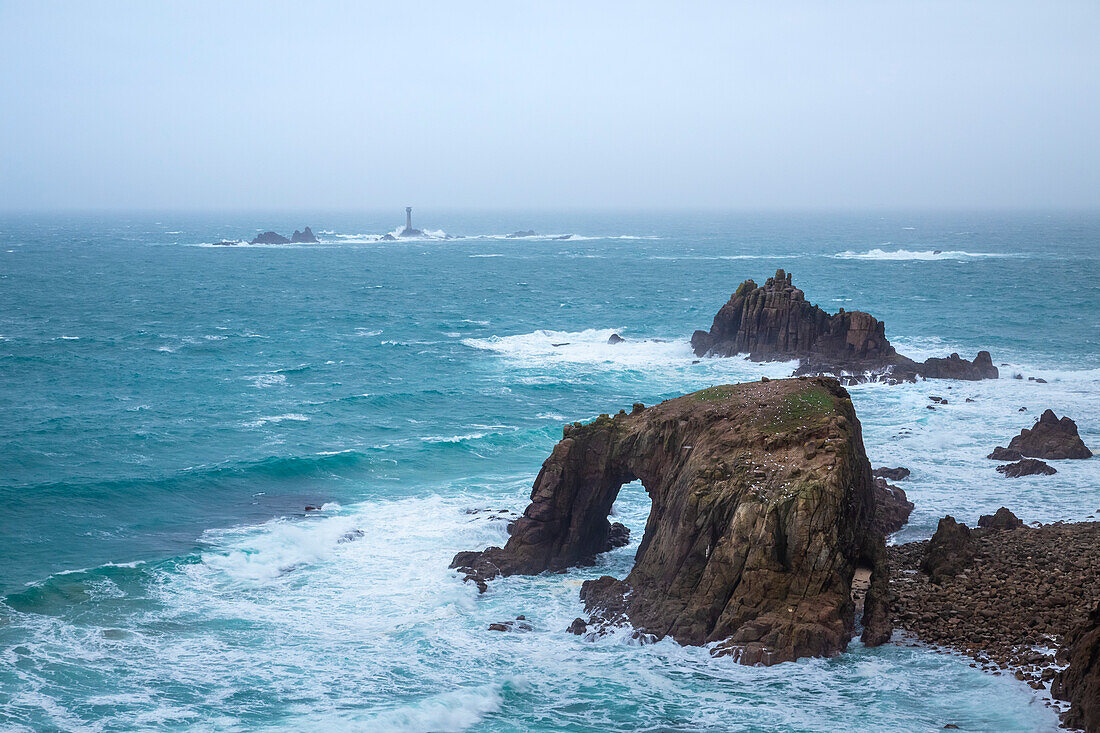 View of the Enys Dodnan Arch at Land's End. Penzance, Western Cornwall, England.