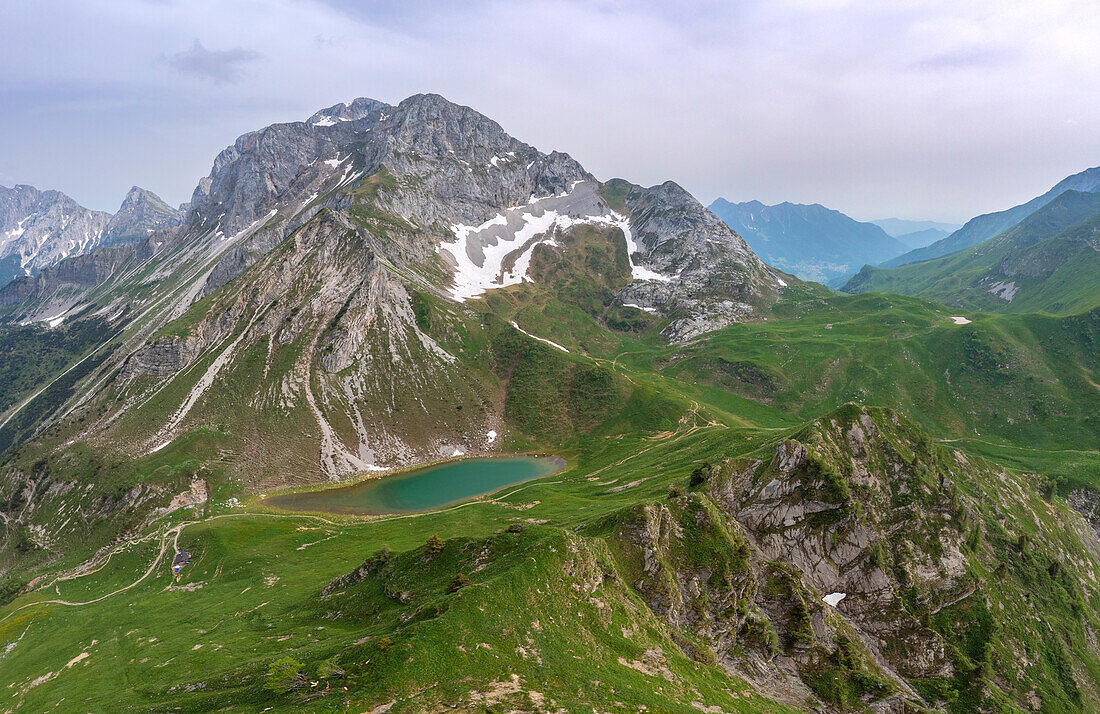 Aerial view of the Branchino lake, Corna Piana and Corno Branchino during spring time. Valcanale, Ardesio, Val Seriana, Bergamo district, Lombardy, Italy, Southern Europe.