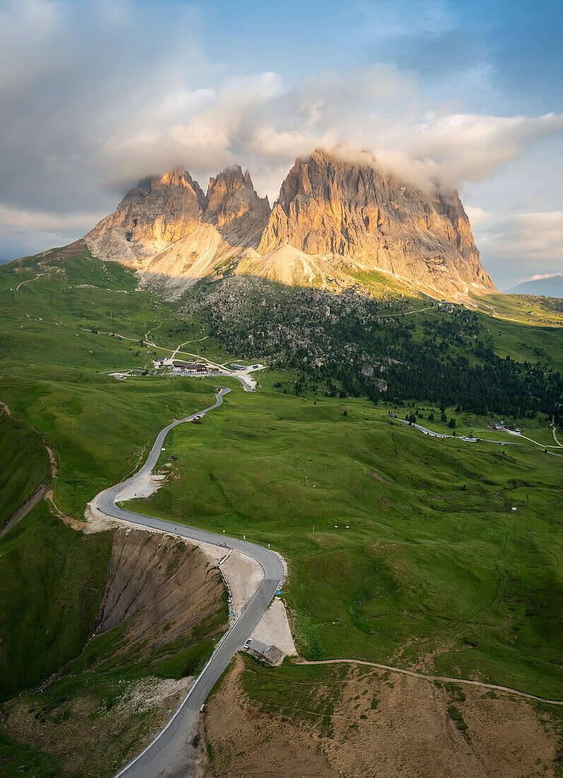 Aerial view of the Sassolungo group during a summer sunrise from Sella Pass. Gardena Valley, Dolomiti, Unesco World Heritage Site, Bolzano district, Trentino Alto Adige, Italy, Europe.