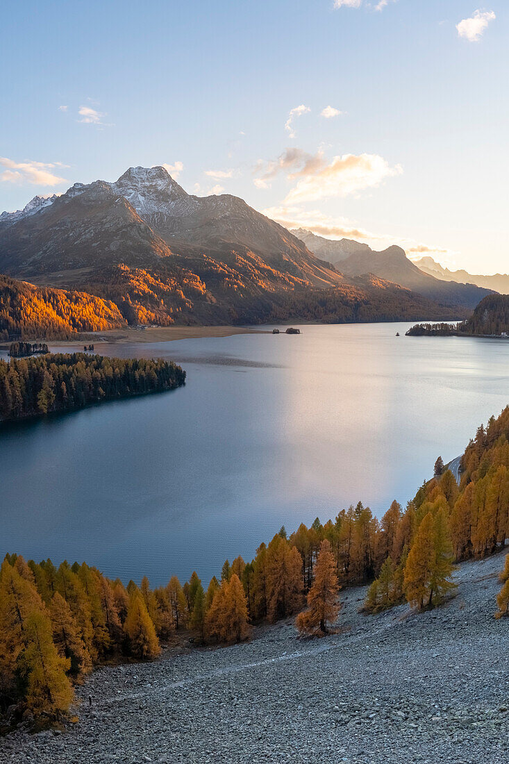 Aerial view of the Sils Lake and peninsula at sunset with Piz da la Margna in autumn. Sils im Engadin/Segl, Engadin, Switzerland, Canton of Grisons.