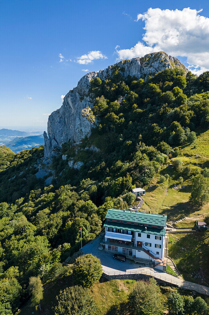 Aerial view of Rifugio Sev dominating on Como Lake (Lecco branch) and located below Corni di Canzo mountains. Valbrona, Como district, Lombardy, Italy, Europe