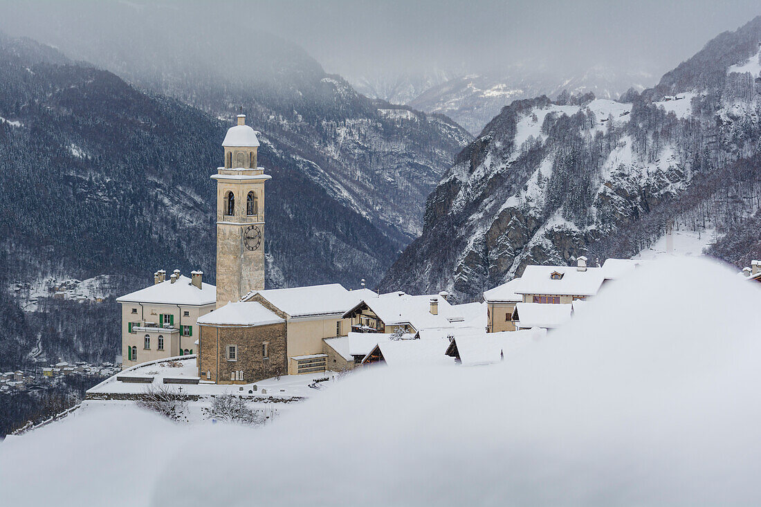 Soglio during a winter snowfal. Bregaglia valley, Maloja district, Switzerland, Europe.