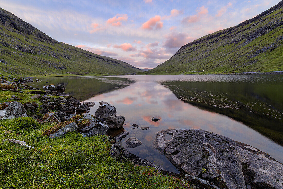 Europe, Denmark, Faroe Islands, Streymoy, Saksun: clouds reflecting in the lake at sunset