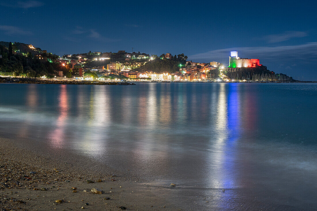 Europe, Italy, Liguria: Lerici seashore with the italian flag colours lighting up the castle