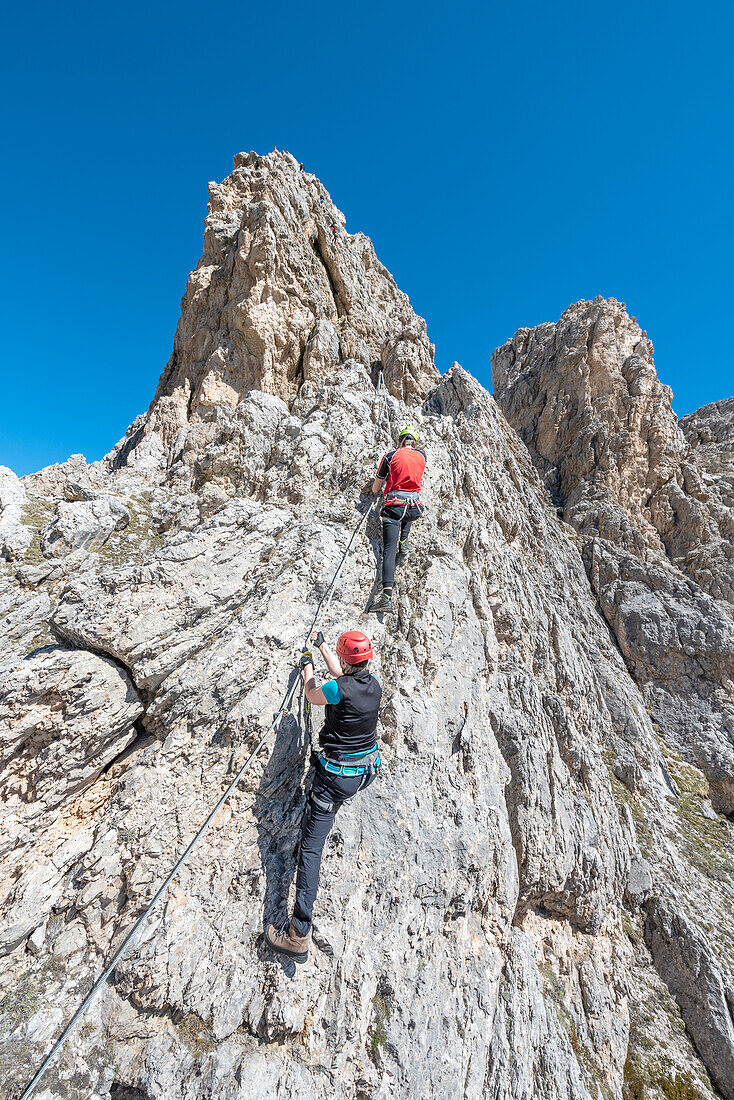 Cir, Dolomites, South Tyrol, Italy. Climbers on the via ferrata of Cir V