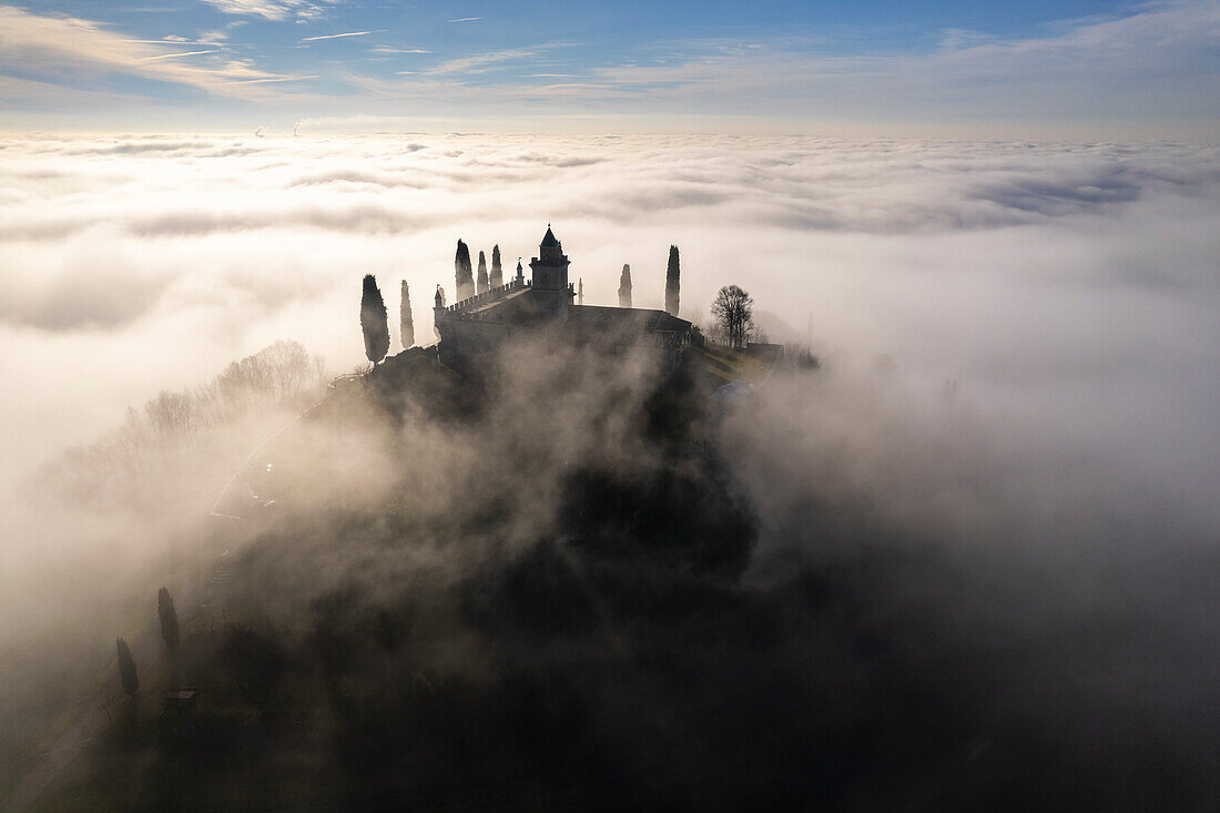 Santissima di Gussago over the clouds in Franciacorta, Brescia province in Lombardy, Italy.