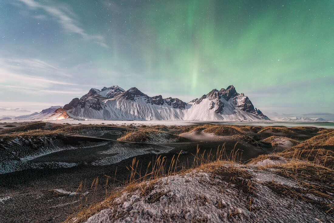 Northern Lights over the Vestrahorn mountains on the Stokksnes beach, Iceland, Europe