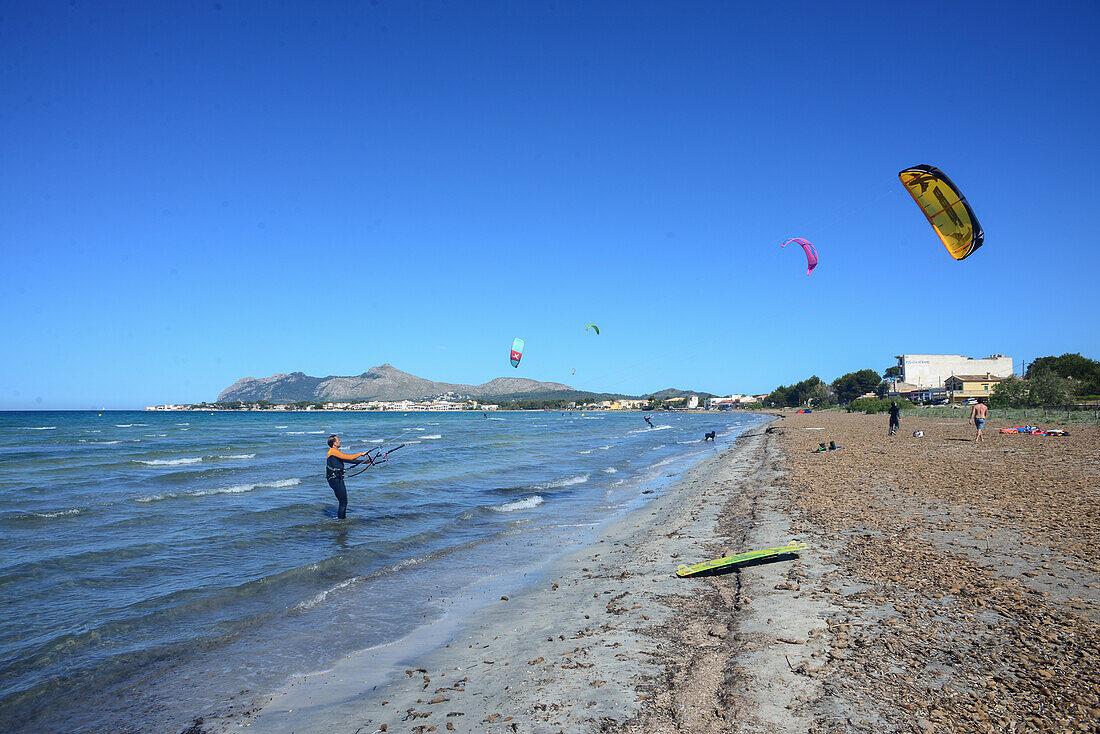 Kitesurfing in Port de Pollenca beach, Mallorca, Spain