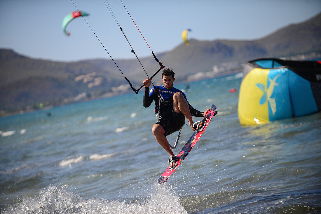 Kitesurfing in Port de Pollenca beach, Mallorca, Spain